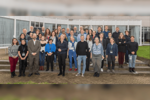 Group photo of the more4nature team in in front of the building of the IHE Delft.