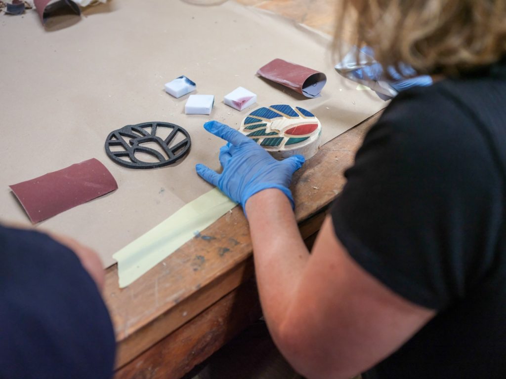 Manufacturing process of the wooden model of the more4nature logo. Painting