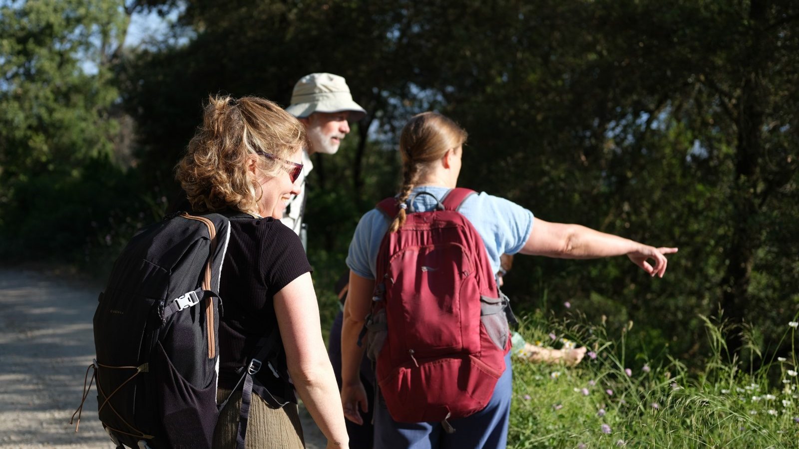 more4nature project partners walking towards Valldaura pointing out the butterflies along the way.